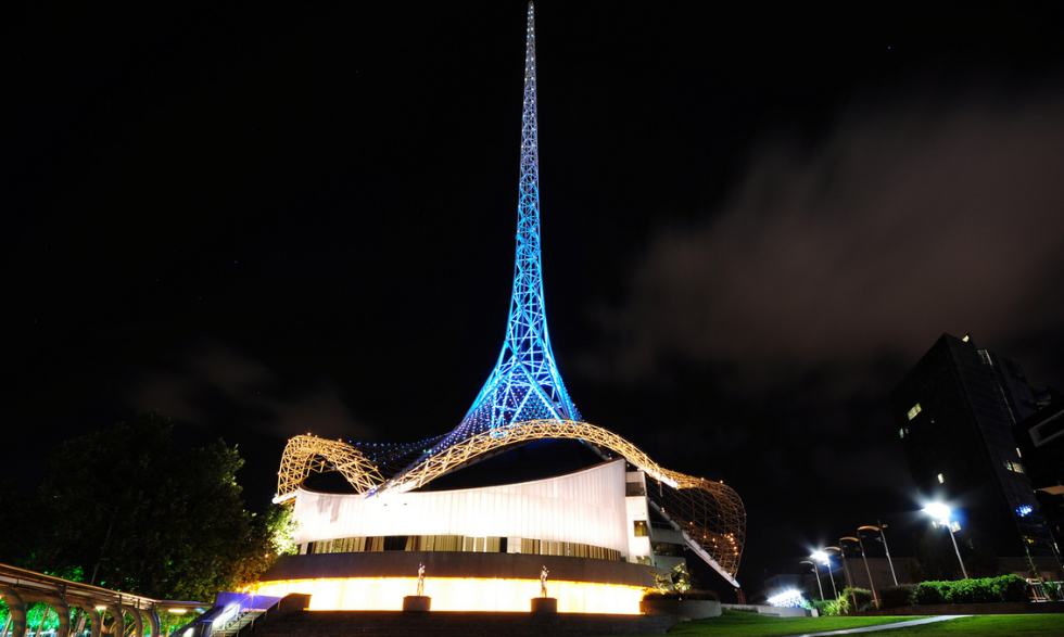 IMAGE: An image of the Arts Centre Melbourne Spire at night - it is lit up with a fantastic blue light.