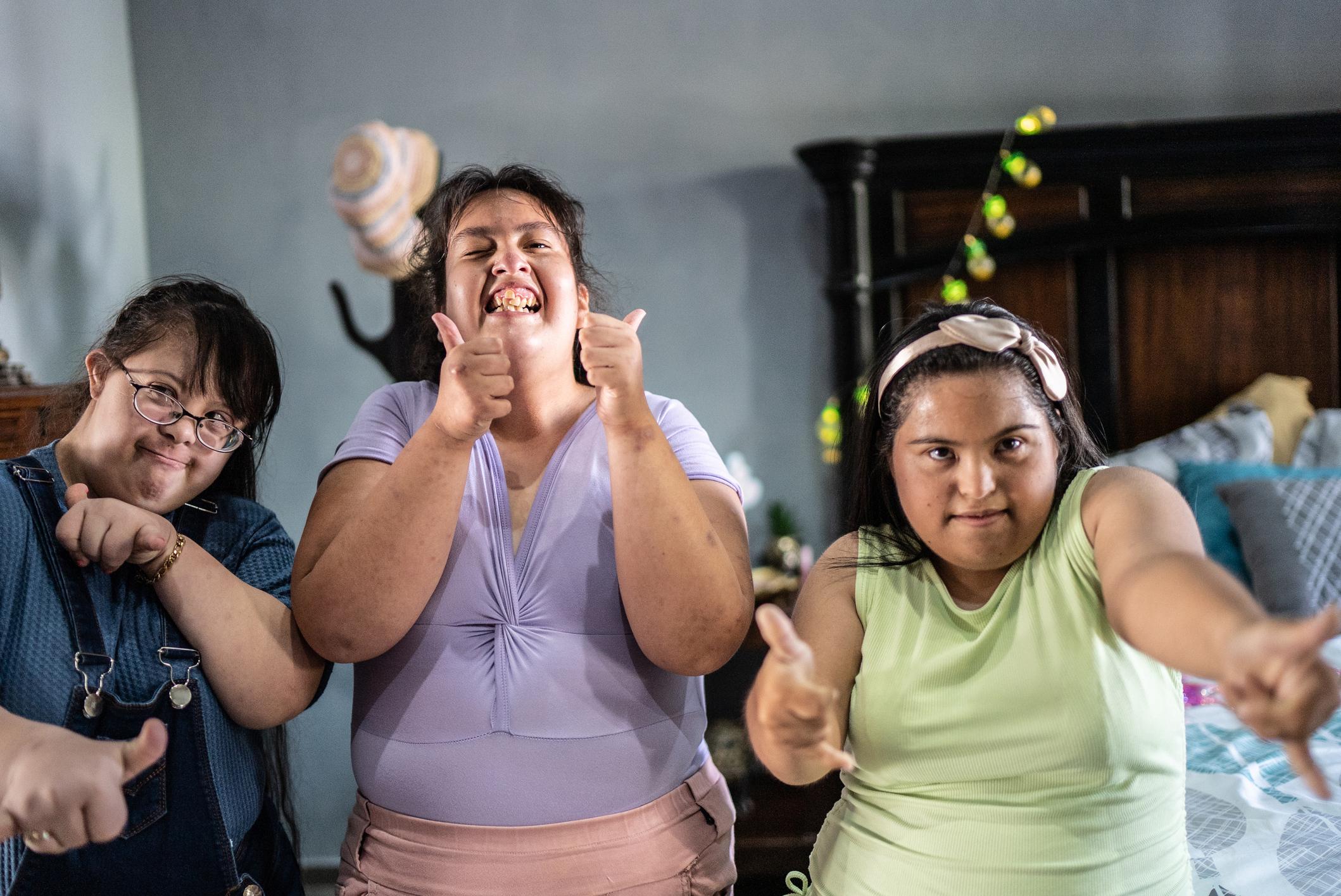 IMAGE: A group of people with disability dancing and smiling