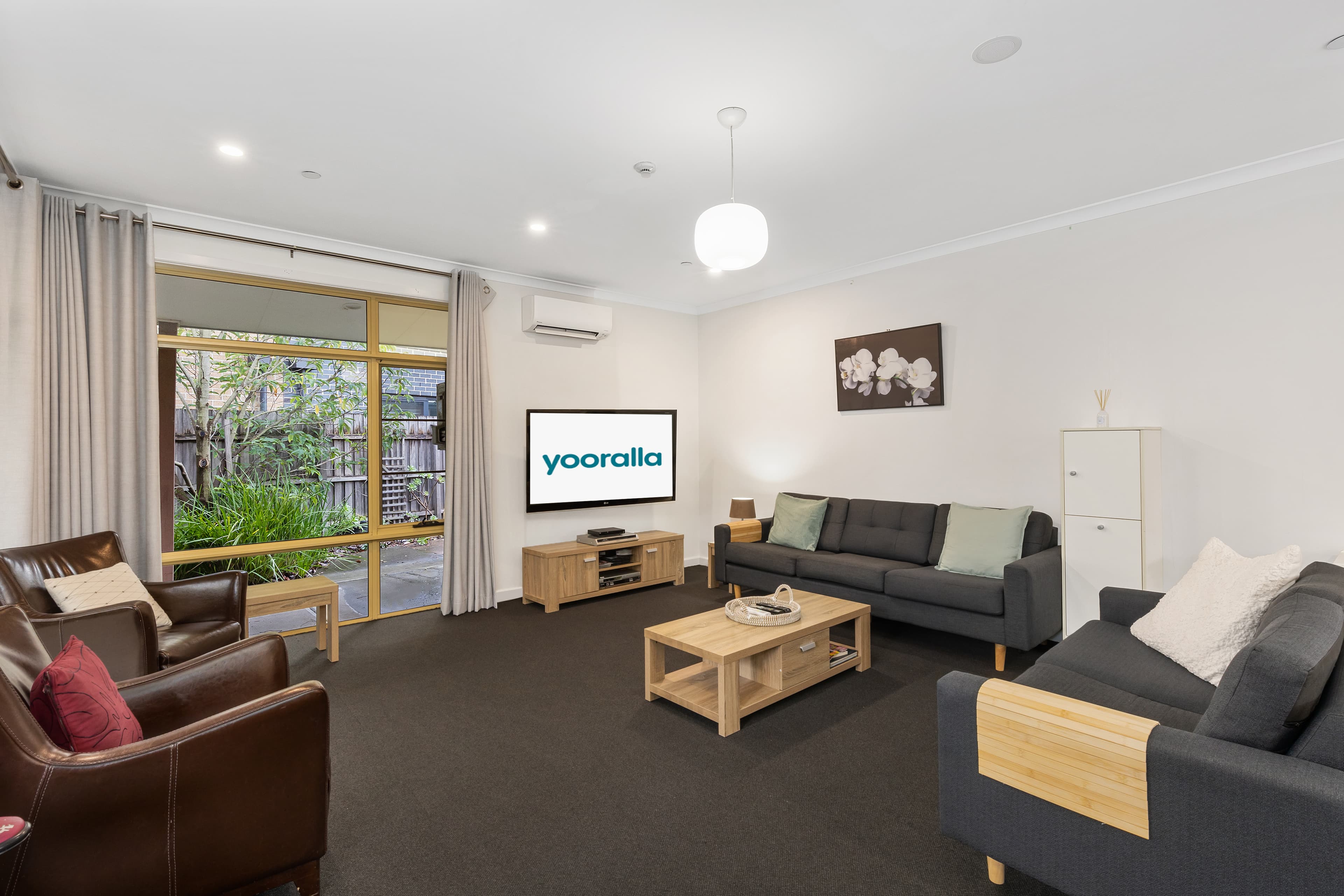 Image: Carpeted living room.